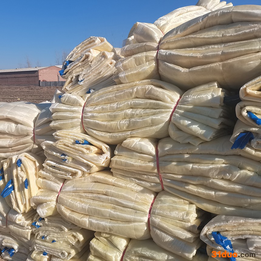 华强保温建材 供应玻璃丝布机制岩棉被 电子玻纤布保温岩棉被