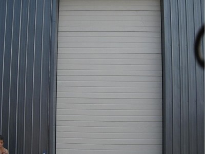 天津武清供应工业翻板滑升门  车库保温滑升门定做安装